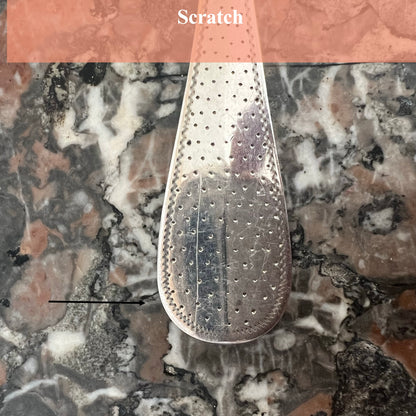 Cuillère à saupoudrer